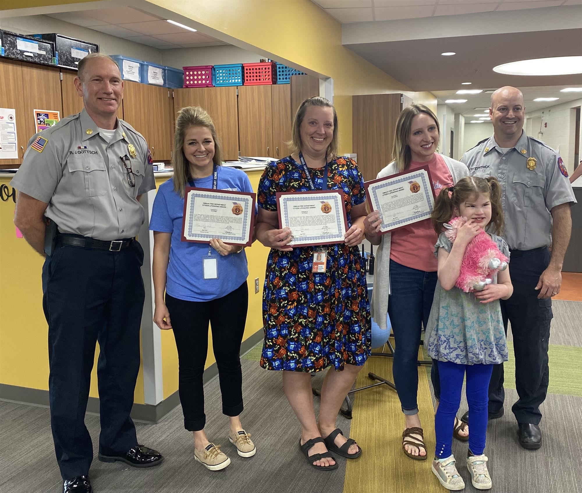 Kim Briggs, Kim Reagan and Erin Hamilton, all staff members at Oakdale Elementary are honored with Life Saver Awards